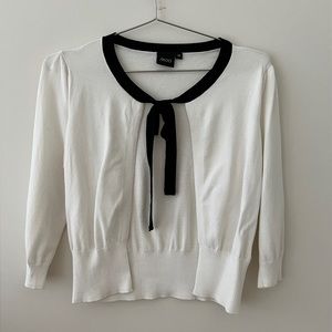 White top with black tie detail in front